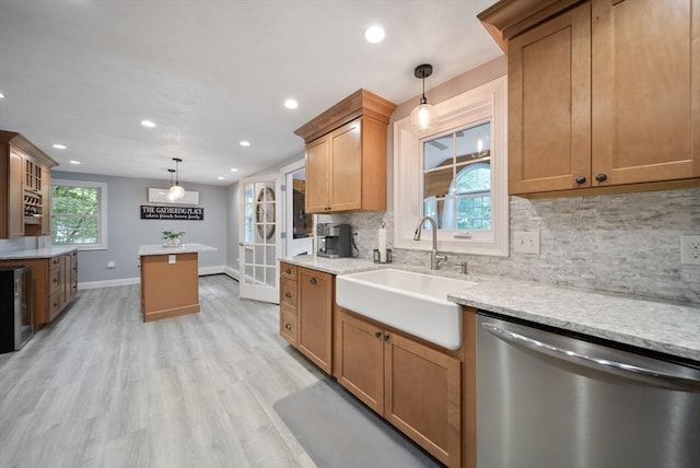 80 E St, Pepperell, MA 01463 - kitchen with stainless steel dishwasher, recessed lighting, tasteful backsplash, light wood finished floors, and hanging light fixtures