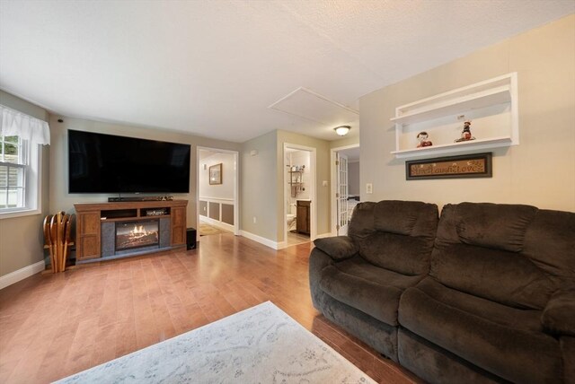 80 E St, Pepperell, MA 01463 - living area with attic access and wood finished floors