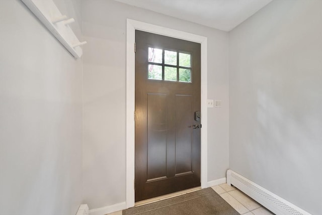 80 E St, Pepperell, MA 01463 - foyer with baseboard heating and light tile patterned floors