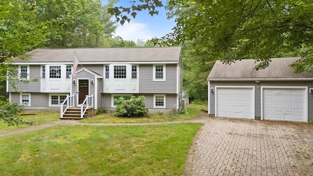 80 E St, Pepperell, MA 01463 - raised ranch featuring a front lawn and a garage