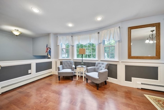 80 E St, Pepperell, MA 01463 - sitting room with baseboard heating, wood finished floors, recessed lighting, and a chandelier