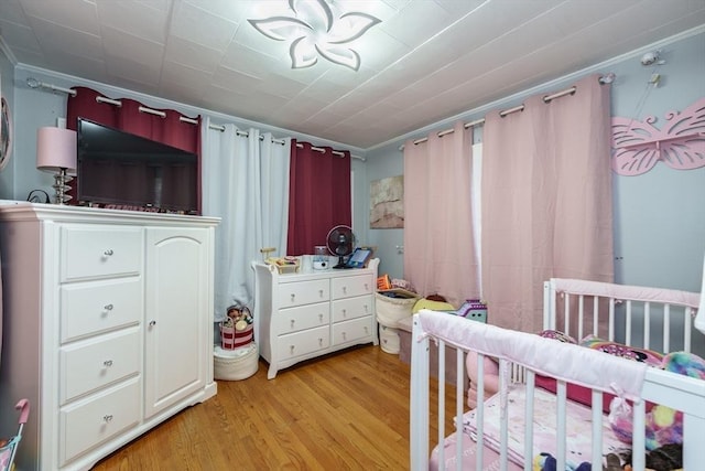 276 Oak St, Springfield, MA 01151 - bedroom featuring light wood-style floors, a nursery area, and crown molding