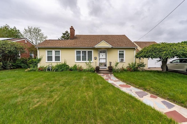 276 Oak St, Springfield, MA 01151 - view of front of home with a chimney, a front yard, and a shingled roof
