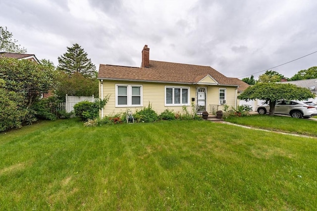 276 Oak St, Springfield, MA 01151 - view of front facade featuring a chimney and a front lawn