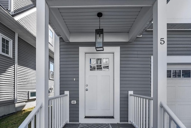 doorway to property featuring a garage