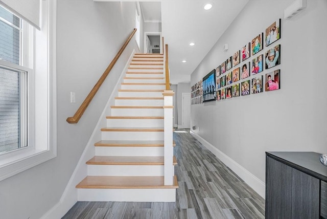 stairs featuring recessed lighting, wood finished floors, and baseboards