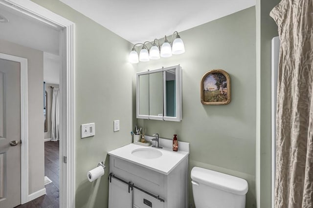 151 Labelle St, West Springfield, MA 01089 - bathroom featuring vanity, wood finished floors, and toilet