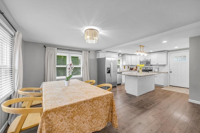 151 Labelle St, West Springfield, MA 01089 - kitchen featuring stainless steel appliances, a chandelier, white cabinetry, a center island, and recessed lighting