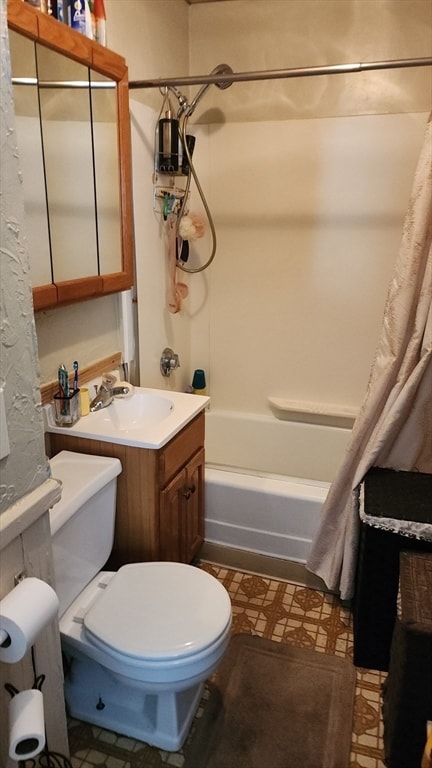 full bathroom with vanity, toilet, and shower / tub combo with curtain