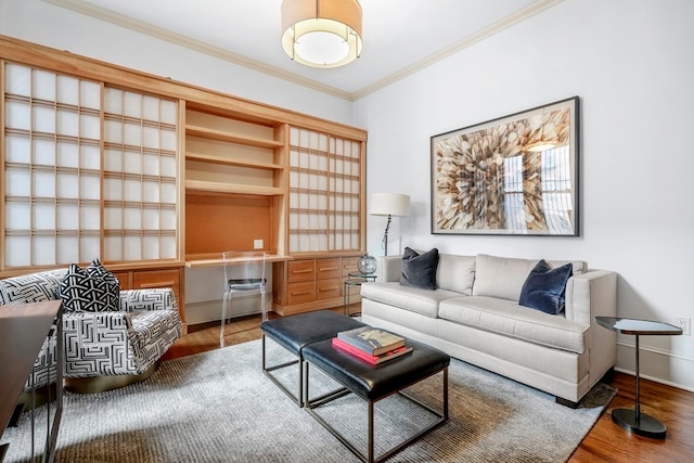 living room with wood-type flooring and ornamental molding