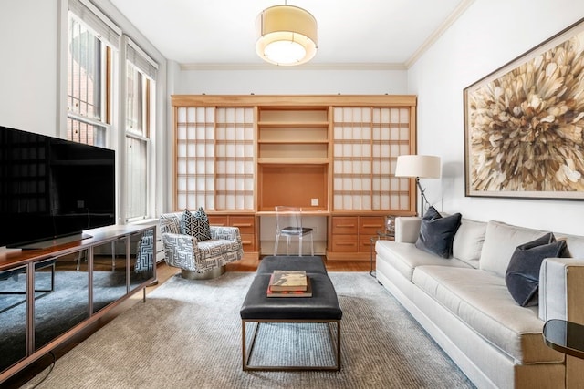 living room featuring hardwood / wood-style flooring and ornamental molding