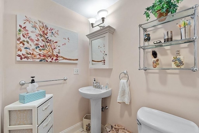 110 O St Unit 1, Boston, MA 02127 - half bath featuring toilet and baseboards