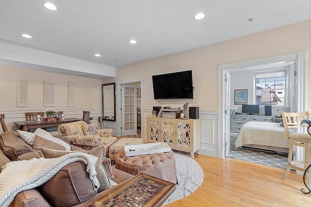 110 O St Unit 1, Boston, MA 02127 - living room featuring recessed lighting, wood finished floors, a decorative wall, and a wainscoted wall