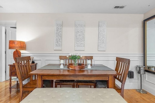 110 O St Unit 1, Boston, MA 02127 - dining space with a decorative wall, a wainscoted wall, wood finished floors, and visible vents
