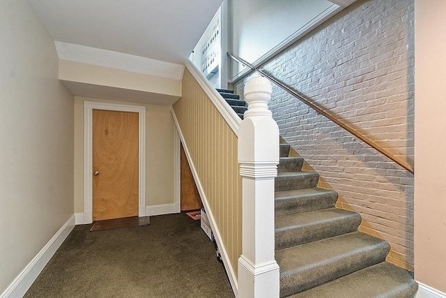 110 O St Unit 1, Boston, MA 02127 - staircase with brick wall and baseboards