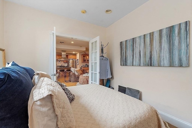 110 O St Unit 1, Boston, MA 02127 - bedroom with baseboards, freestanding refrigerator, and recessed lighting