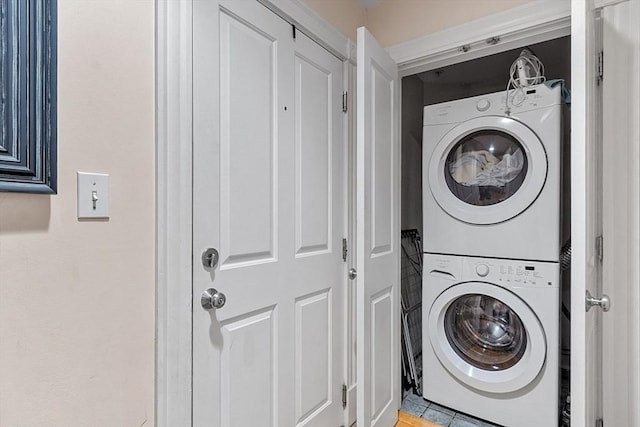 110 O St Unit 1, Boston, MA 02127 - laundry room featuring light tile patterned floors, stacked washer / dryer, and laundry area