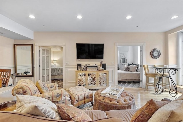 110 O St Unit 1, Boston, MA 02127 - living area featuring a wainscoted wall, wood finished floors, recessed lighting, and a decorative wall