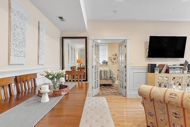110 O St Unit 1, Boston, MA 02127 - hall with light wood-style floors, visible vents, and a wainscoted wall