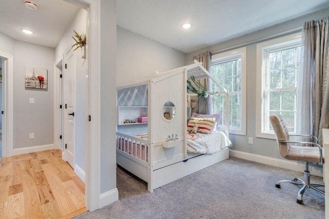 bedroom with light hardwood / wood-style flooring