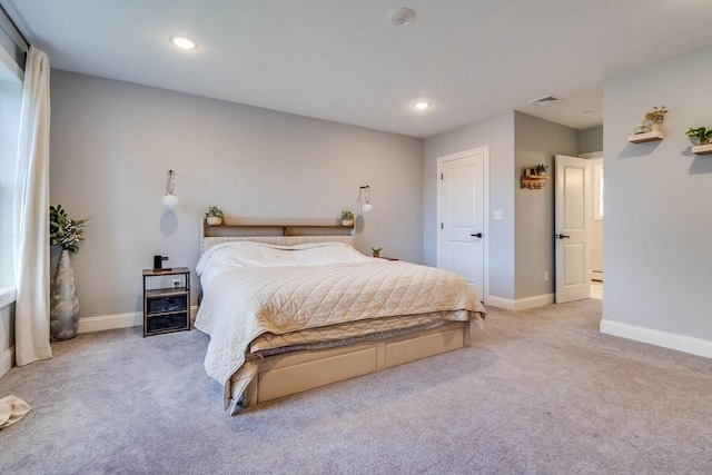 bedroom featuring light colored carpet