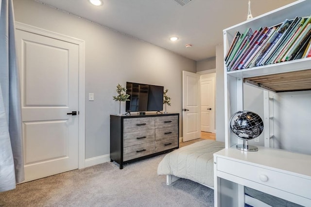 bedroom featuring light colored carpet