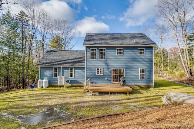 back of house featuring a yard and a deck