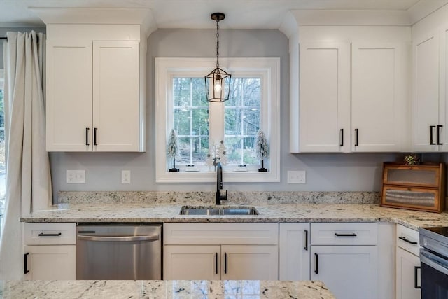 kitchen featuring dishwasher, sink, hanging light fixtures, light stone counters, and white cabinetry