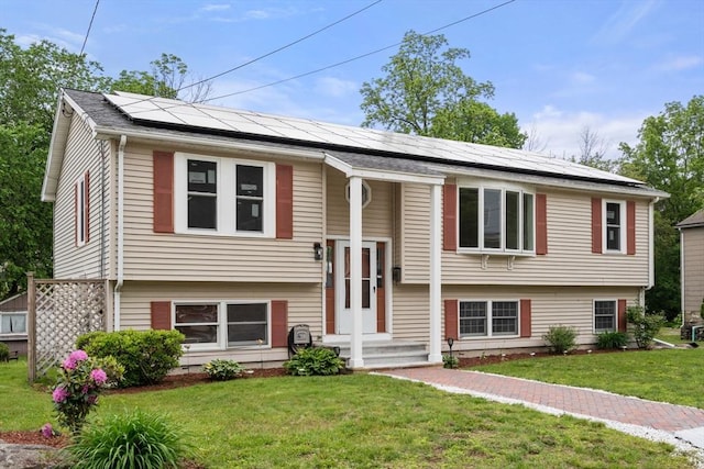 29 Hudson Ave, Southbridge, MA 01550 - split foyer home featuring roof mounted solar panels and a front yard