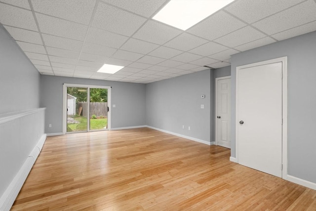 29 Hudson Ave, Southbridge, MA 01550 - empty room featuring light wood finished floors, a paneled ceiling, and baseboards