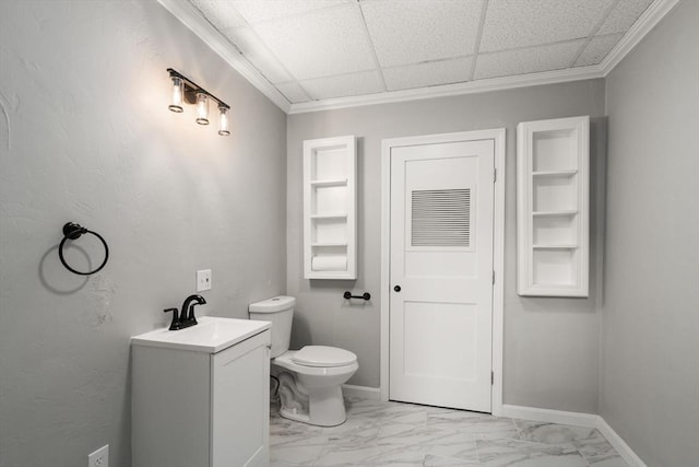 29 Hudson Ave, Southbridge, MA 01550 - bathroom with toilet, marble look tile flooring, vanity, ornamental molding, and baseboards