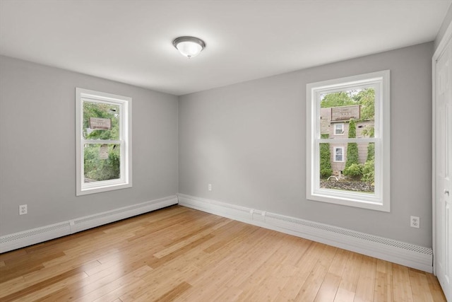 29 Hudson Ave, Southbridge, MA 01550 - spare room featuring healthy amount of natural light, a baseboard radiator, light wood-style floors, and baseboards
