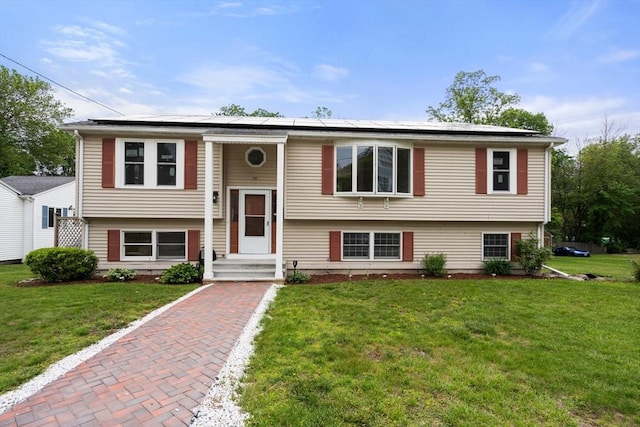 29 Hudson Ave, Southbridge, MA 01550 - bi-level home with roof mounted solar panels and a front yard