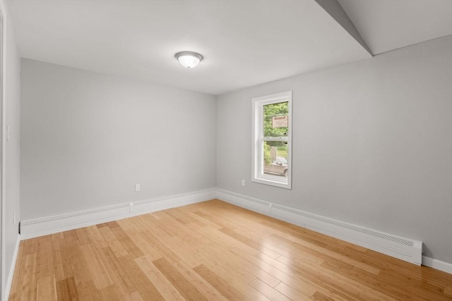 29 Hudson Ave, Southbridge, MA 01550 - unfurnished room with wood finished floors, baseboards, and a baseboard radiator