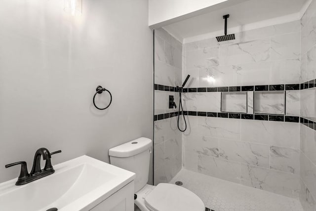 29 Hudson Ave, Southbridge, MA 01550 - bathroom featuring a tile shower, toilet, and vanity