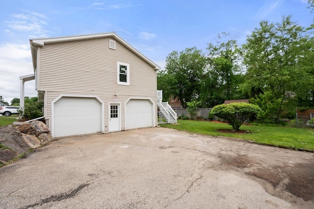 29 Hudson Ave, Southbridge, MA 01550 - view of property exterior featuring stairway, a garage, and driveway