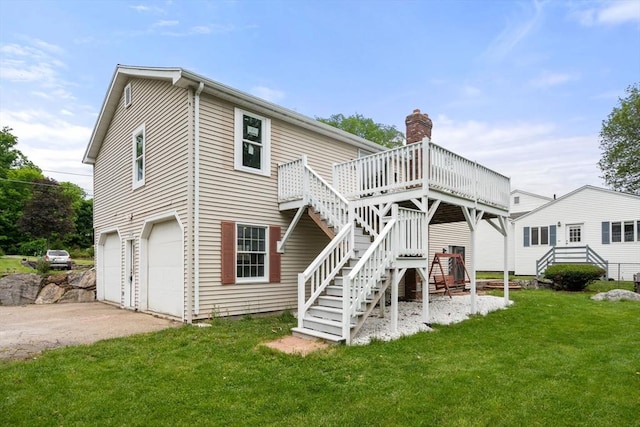29 Hudson Ave, Southbridge, MA 01550 - rear view of property featuring stairway, a garage, a deck, a lawn, and driveway