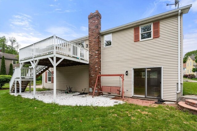 29 Hudson Ave, Southbridge, MA 01550 - back of house featuring a wooden deck, stairs, a lawn, and a chimney