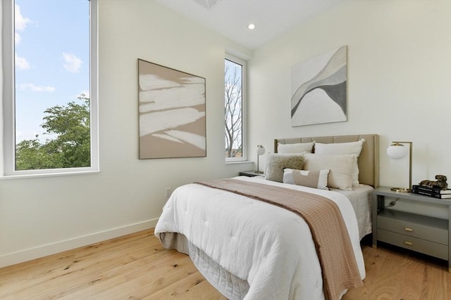 bedroom with light hardwood / wood-style floors