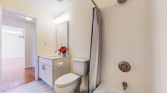 full bathroom with toilet, vanity, and shower / tub combo with curtain