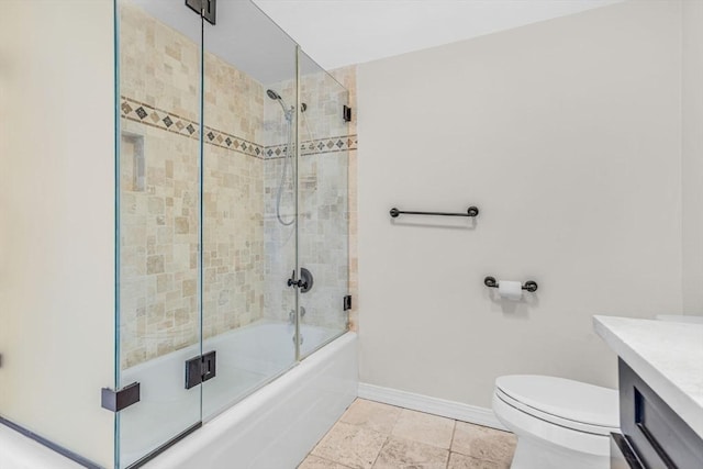 280 Boylston St Unit 511, Newton, MA 02467 - bathroom with baseboards, vanity, toilet, and bath / shower combo with glass door