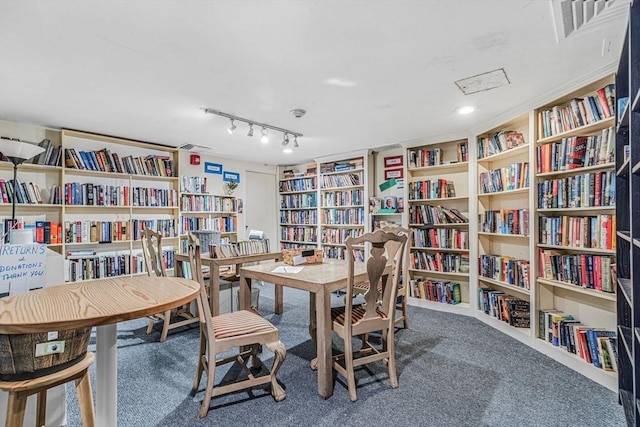 280 Boylston St Unit 511, Newton, MA 02467 - carpeted home office featuring wall of books and rail lighting