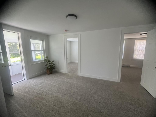 26A Duval Ct, Winchendon, MA 01475 - carpeted empty room featuring a baseboard radiator and baseboards