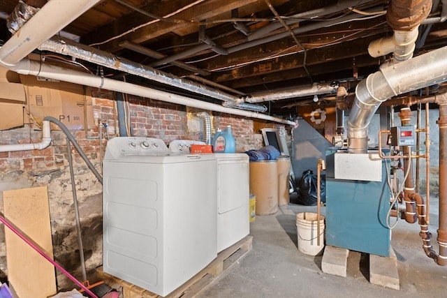 basement featuring washing machine and clothes dryer