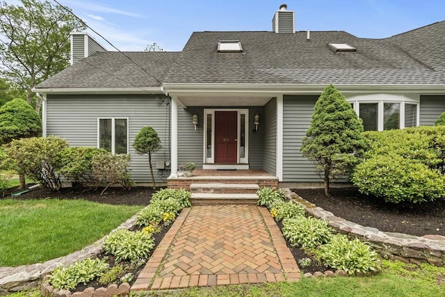 26 Emery Ct, Stoneham, MA 02180 - view of front of house featuring a chimney and a shingled roof