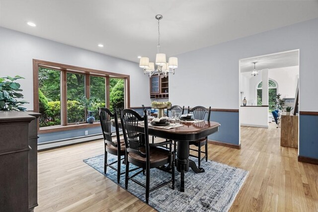 26 Emery Ct, Stoneham, MA 02180 - dining room with a baseboard heating unit, a chandelier, light wood finished floors, and recessed lighting
