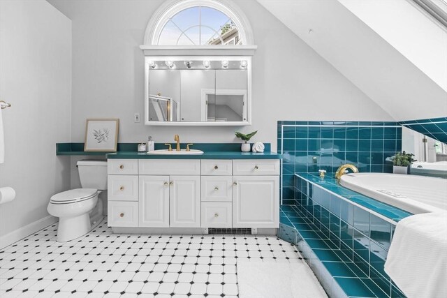 26 Emery Ct, Stoneham, MA 02180 - bathroom with vanity, a bath, and lofted ceiling