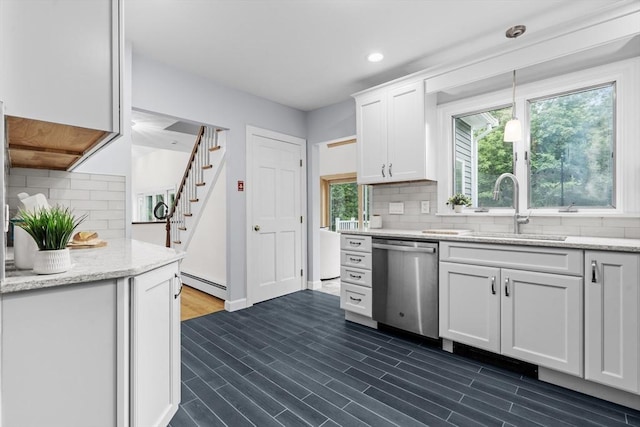 26 Emery Ct, Stoneham, MA 02180 - kitchen with stainless steel dishwasher, baseboard heating, white cabinets, backsplash, and recessed lighting