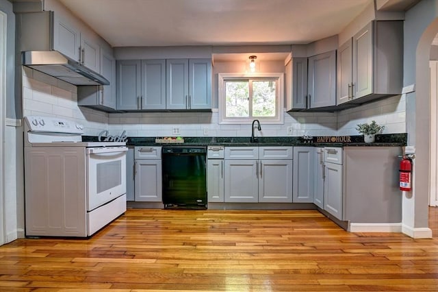 kitchen featuring dishwasher, electric range, light hardwood / wood-style floors, and gray cabinetry