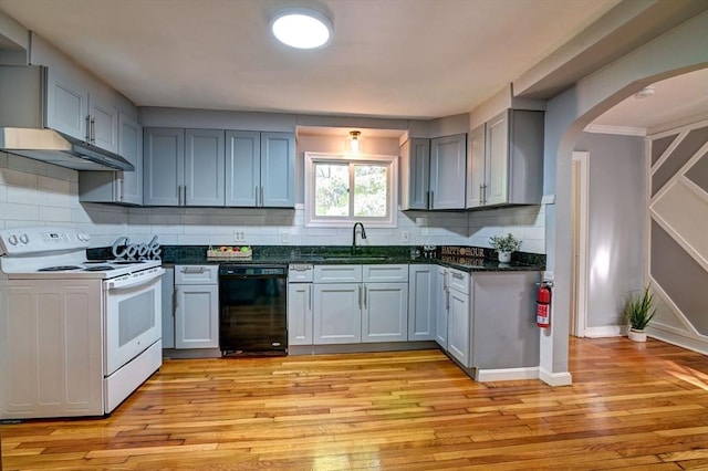 kitchen featuring white range with electric cooktop, sink, light wood-type flooring, and black dishwasher